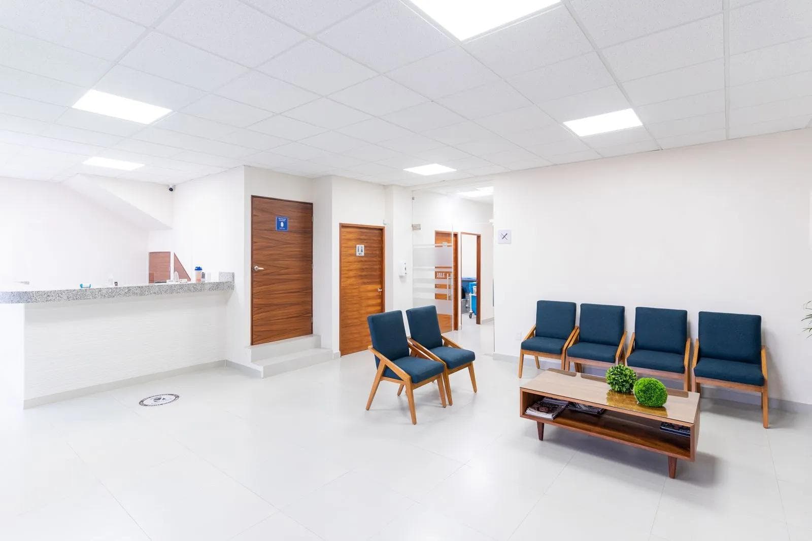 A bright, welcoming clinic waiting room with modern seating